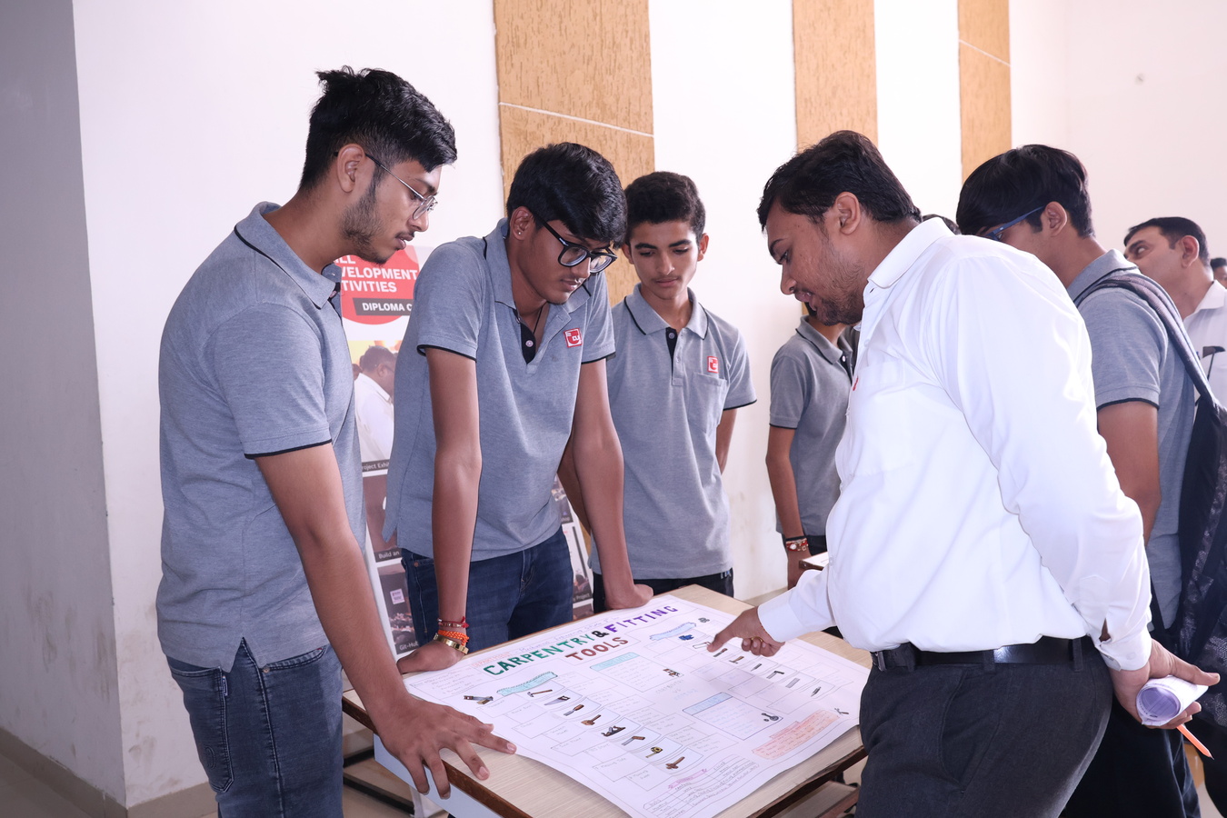 Photos of Student Innovation Poster Presentation through Mechanical Ideas.